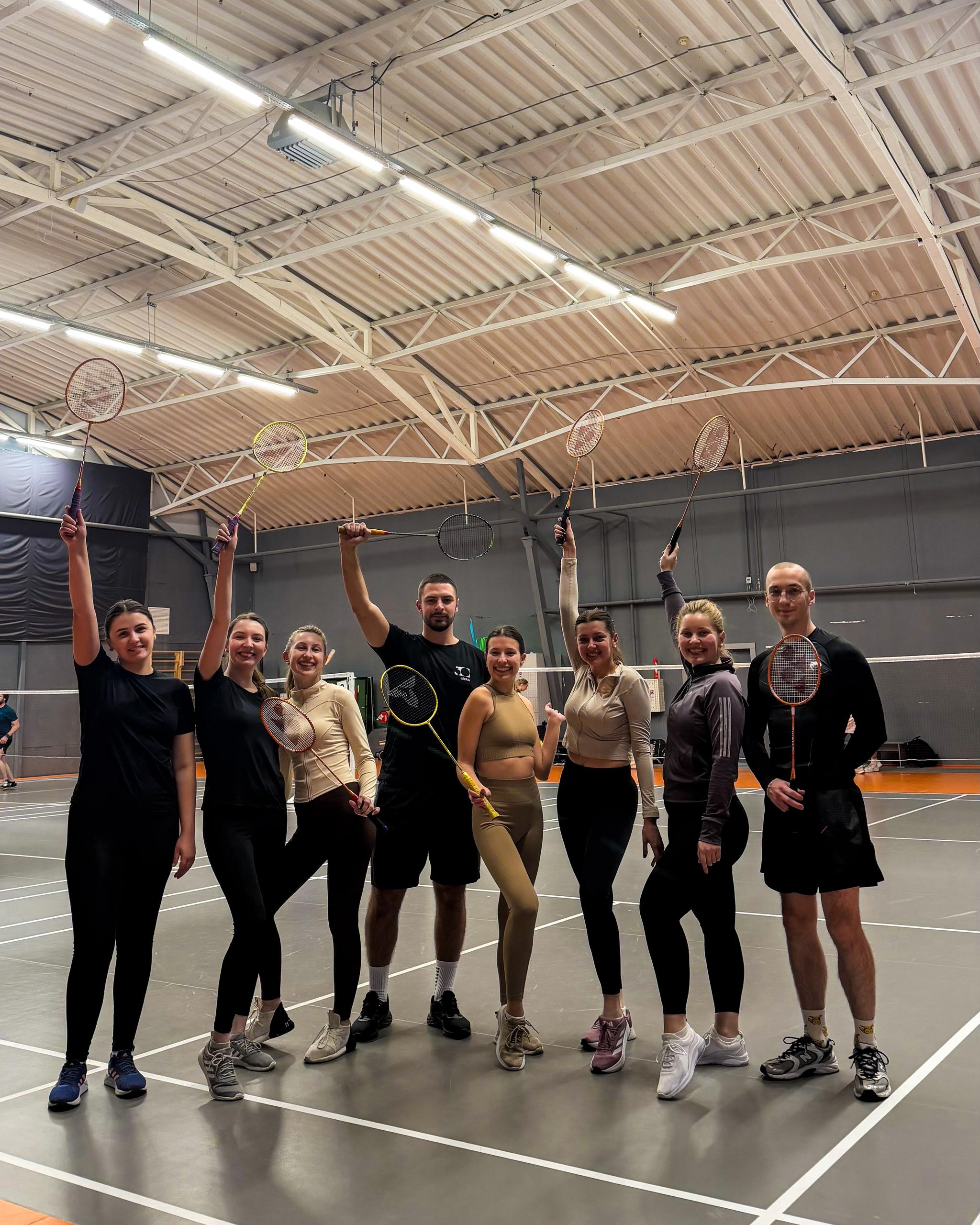 Binariks colleagues playing badminton after work