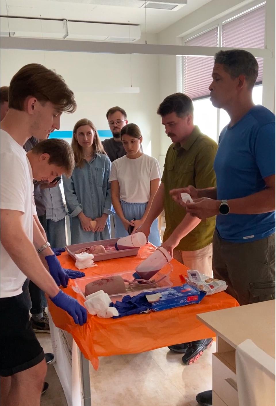 Binariks employees practicing first aid during tactical medicine training
