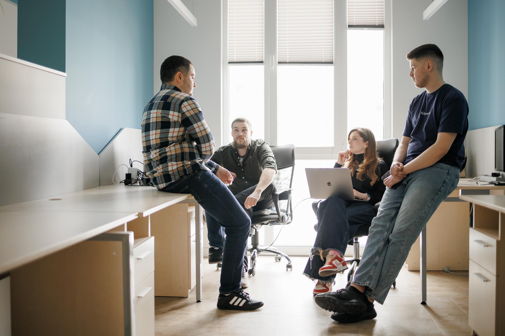 Binariks colleagues talking during a team event